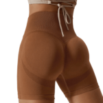 High-waisted brown athletic shorts with adjustable drawstring and breathable mesh panels.