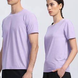Two people wear stylish lavender t-shirts, paired with black pants for a casual chic look.