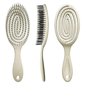 Elegant beige hairbrushes: detangler, precision comb, volume-enhancing styling brush.